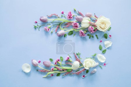 Photo for Frame of beautiful flowers on blue  background - Royalty Free Image