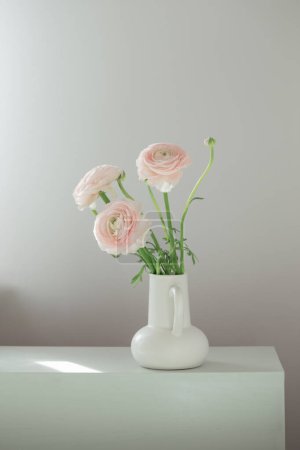 Photo for Spring flowers in vase in white modern interior - Royalty Free Image