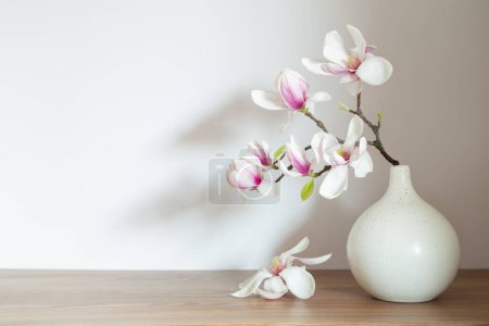 Photo for Magnolia flowers in vase in white background - Royalty Free Image