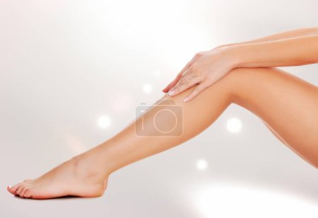 Photo for Woman legs and hands, white background - Royalty Free Image