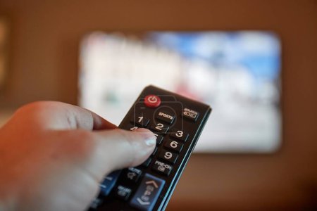 Using remote control for switching programs on TV