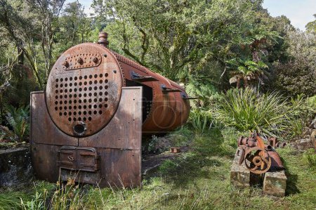 Photo for Old rusty steel boiler, remains of a historic sawmill in Rakiura, New Zealand - Royalty Free Image