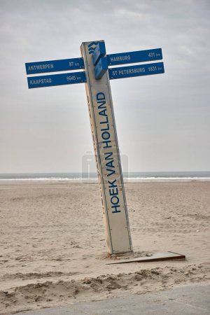 Photo for Direction sign board at Hoek Van Holland Beach, South Holland, The Netherlands. Sandy beach of the North Sea - Royalty Free Image