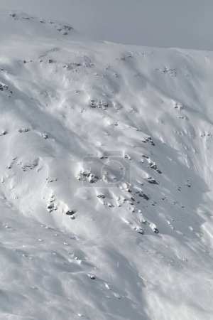 Photo for Snowy mountain slopes in the the Alps, untouched powder snow for freeride - Royalty Free Image