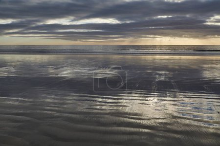 Photo for Sandy beach in a sea bay, calm water reflection - Royalty Free Image