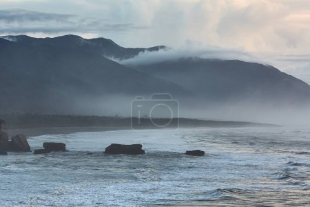 Photo for Beach in cloudy mist at Pancake Rocks, New Zealand South Island - Royalty Free Image