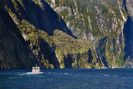 Photo for Iconic landscape at Milford Sound in Fjordland, New Zealand. Going on a touristic boat ride - Royalty Free Image