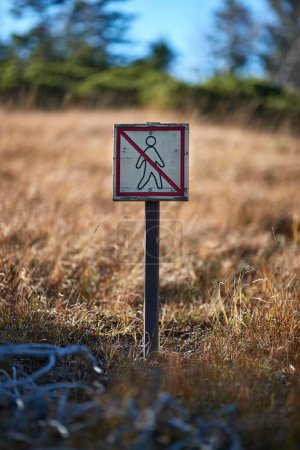 Photo for No entry sign of a nature protection area along a hiking trail. Krkonose national park, Czech Republic - Royalty Free Image