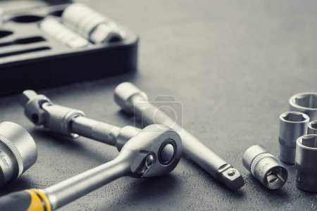 Photo for Ratchet and bits tool kit. Socket wrench and ratchet heads. Tool kit for the car on background. Equipment for auto mechanic for car repair at a service station. - Royalty Free Image