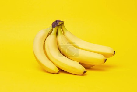 Photo for Bananas on a yellow background - Royalty Free Image