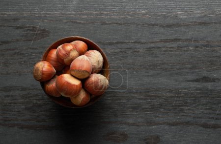 Photo for Hazelnut on a wooden background - Royalty Free Image