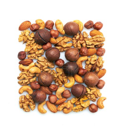 Photo for Pattern of nuts mix. Hazelnut, macadamia, almonds, walnut, cashew, brazil nut, isolated on white background. Top view. - Royalty Free Image