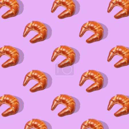 Photo for Baking croissant roll on purple background. Top view. Pop art design. Flat minimal lay style. - Royalty Free Image