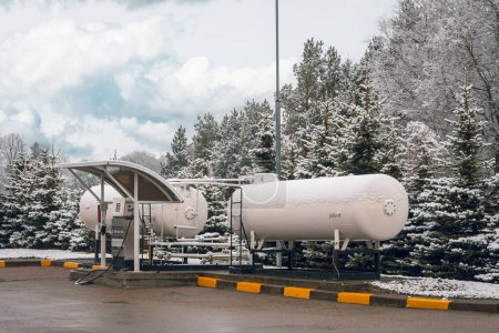 Large industrial iron barrels at a gas station. LPG liquid petroleum gas station. Environmentally friendly fuel.