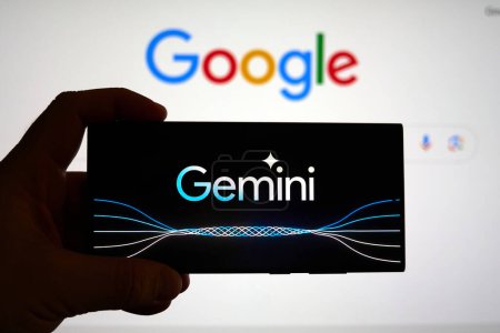 Photo for DALLAS, TX USA - FEBRUARY 19, 2024: A hand holding a cellphone with Google Gemini logo over google.com search page. Google Gemini 1.5 is a next generation large language model developed by Google AI - Royalty Free Image