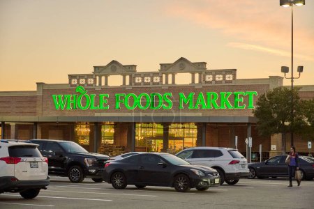 Photo for Dallas TX, USA - February 25, 2024: Entrance to Whole Foods Market store. Owned by Amazon, Whole Foods a US grocery chain based in Texas sells food free of artificial ingredients and unhealthy fats. - Royalty Free Image