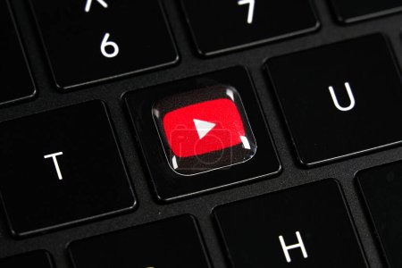 Photo for Dallas, TX USA - February 24, 2024: Youtube logo red button on Y key on laptop keyboard. Tech giant Google focuses on AI, search, software, and more, from online ads to electronics. - Royalty Free Image