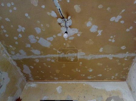 Shabby walls and ceiling. Apartment renovation in the kitchen.