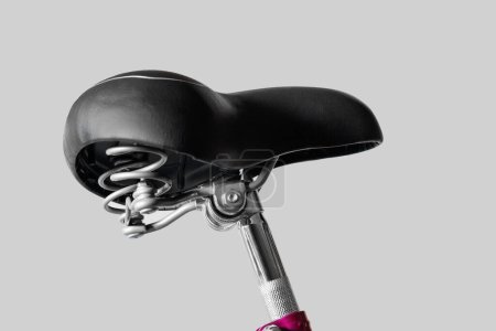 Foto de Bicycle saddle wide. Seat post. Close-up. Isolated on light gray background. - Imagen libre de derechos