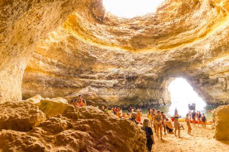 Photo for Algarve, Portugal - 26 August, 2023: People visiting the Benagil cave. The beautiful site is famous by its beach and the light coming from a large hole in the roof. - Royalty Free Image