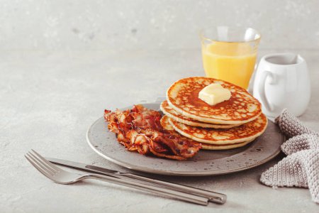 Photo for Sweet pancakes with butter and bacon. traditional american breakfast - Royalty Free Image