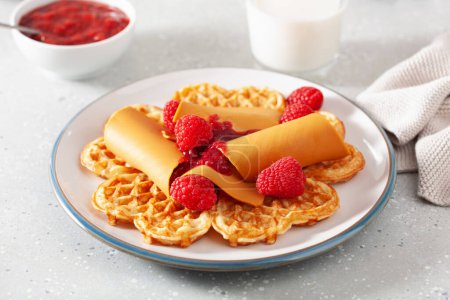 waffles with Norwegian brunost traditional brown cheese and raspberry jam