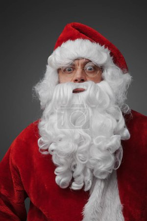 Photo for Shot of christmas santa claus with beard dressed in winter hat. - Royalty Free Image
