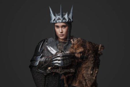 Photo for Studio shot of medieval female knight with crown and chainmail. - Royalty Free Image