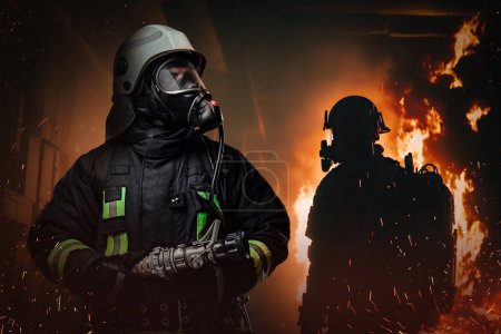 Photo for Shot of dangerous firefighter dressed in fire protective suit in burning city. - Royalty Free Image