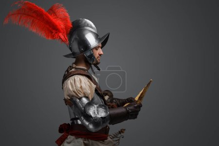 Photo for Studio shot of isolated on gray background conquistador with map. - Royalty Free Image