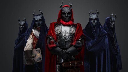 Photo for Studio shot of five members of occult brotherhood against gray background. - Royalty Free Image