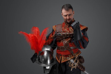 Photo for Shot of handsome and confident musketeer man dressed in stylish costume. - Royalty Free Image