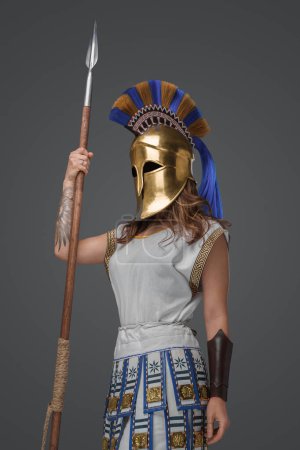 Photo for Shot of isolated on grey background greek soldier woman holding spear. - Royalty Free Image