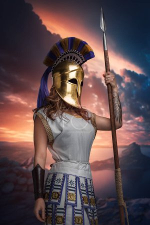 Photo for Artwork of warlike woman dressed in tunic and helmet holding spear against sky. - Royalty Free Image