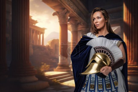 Photo for Shot of female greek general dressed in cloak and tunic against ancient building. - Royalty Free Image
