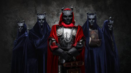 Téléchargez les photos : Studio shot of esoteric brotherhood of five people with robes and horned masks. - en image libre de droit