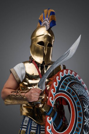 Photo for Studio shot of military man from antique greece with shield and gladius. - Royalty Free Image