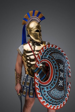 Photo for Studio shot of military man from ancient greece with shield and sword. - Royalty Free Image