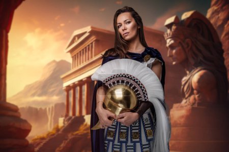 Photo for Shot of female greek general dressed in cloak and tunic against ancient building. - Royalty Free Image