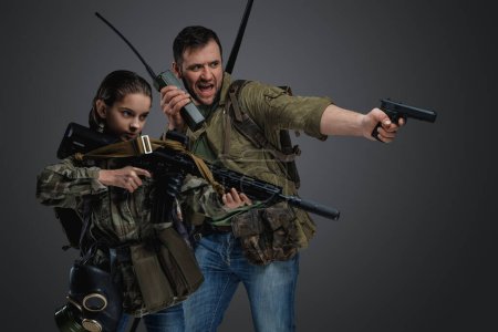 Photo for Studio shot of post apocalyptic girl teenager and man surviving after armageddon. - Royalty Free Image