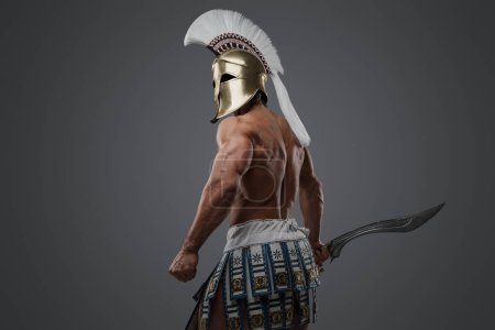 Photo for Shot of isolated on gray background muscular warrior from antique greece. - Royalty Free Image