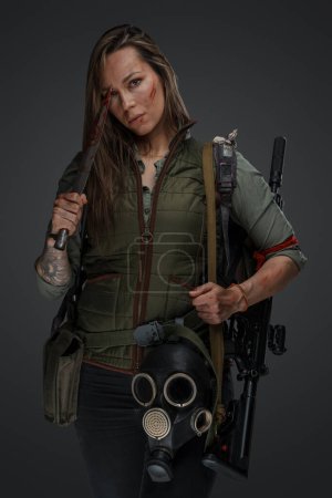Photo for Portrait of brown haired woman mercenary in setting of post apocalypse. - Royalty Free Image