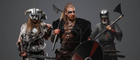 Photo for Portrait of furious vikings barbarians dressed in chainmail and fur. - Royalty Free Image