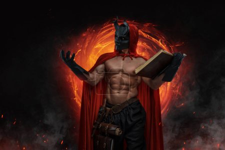 Portrait of mystical wizard with muscular build and horned mask against dark background.