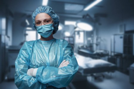 Photo for Shot of surgeon woman posing with crossed arms against modern operating room. - Royalty Free Image