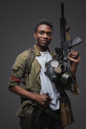 Portrait of african man pirate in setting of post apocalypse looking at camera.