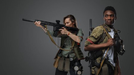 Photo for Shot of black man and white woman with rifles isolated on grey background. - Royalty Free Image