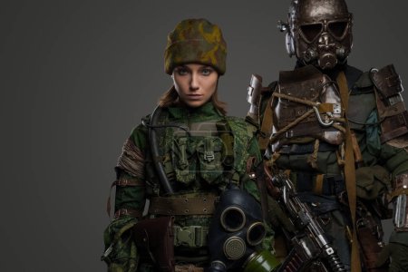 Photo for Portrait of post apocalyptic female and male soldiers surviving in radioactive catastrophe. - Royalty Free Image