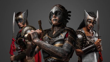 Photo for Shot of isolated on grey background female warriors from past with spears and sword. - Royalty Free Image