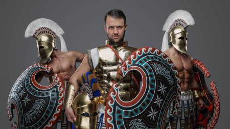 Photo for Portrait of ancient warlord fromt greece and two greek warriors with shields. - Royalty Free Image